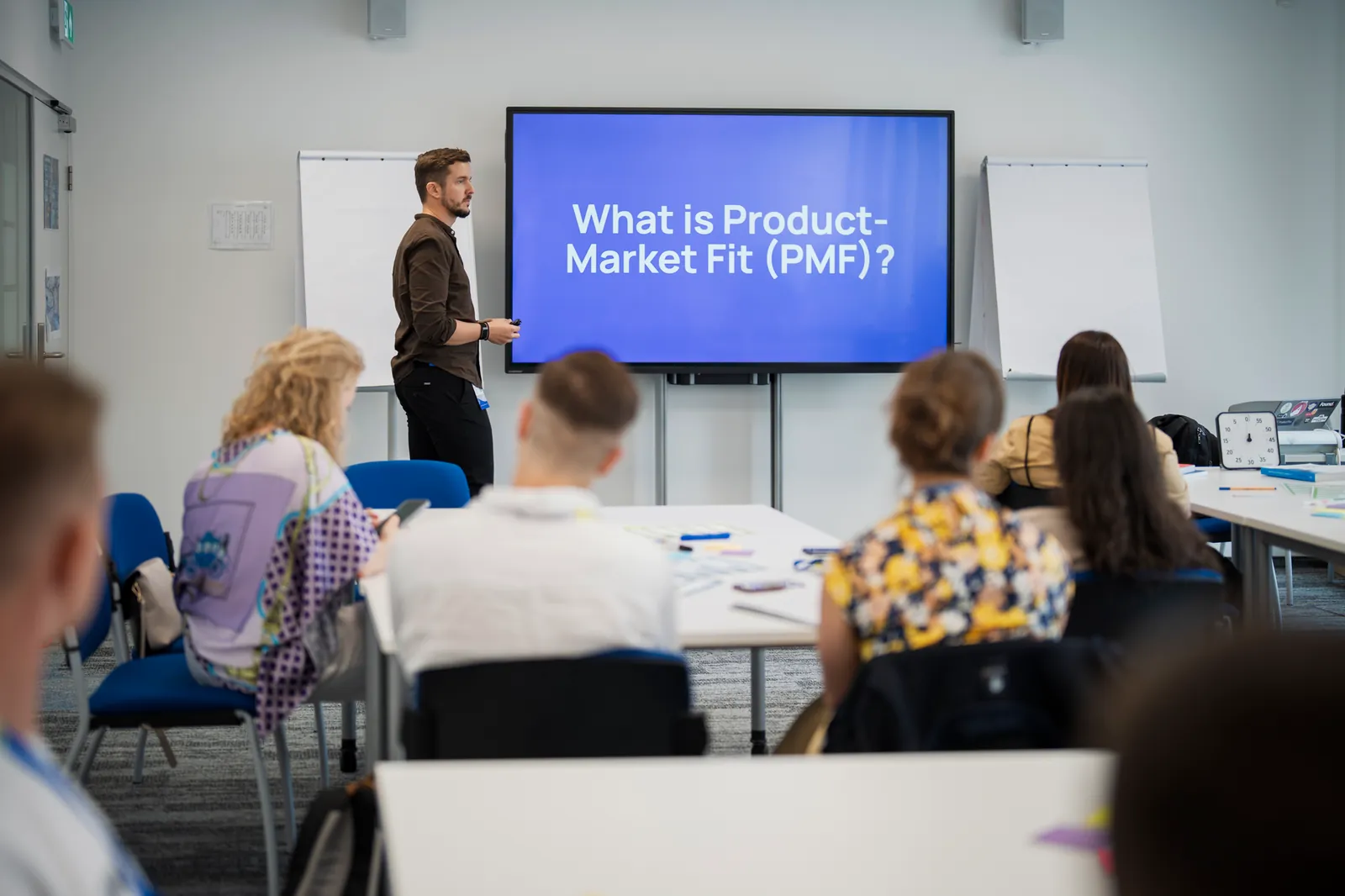Founders working toward Product-Market Fit in a PMF Program session